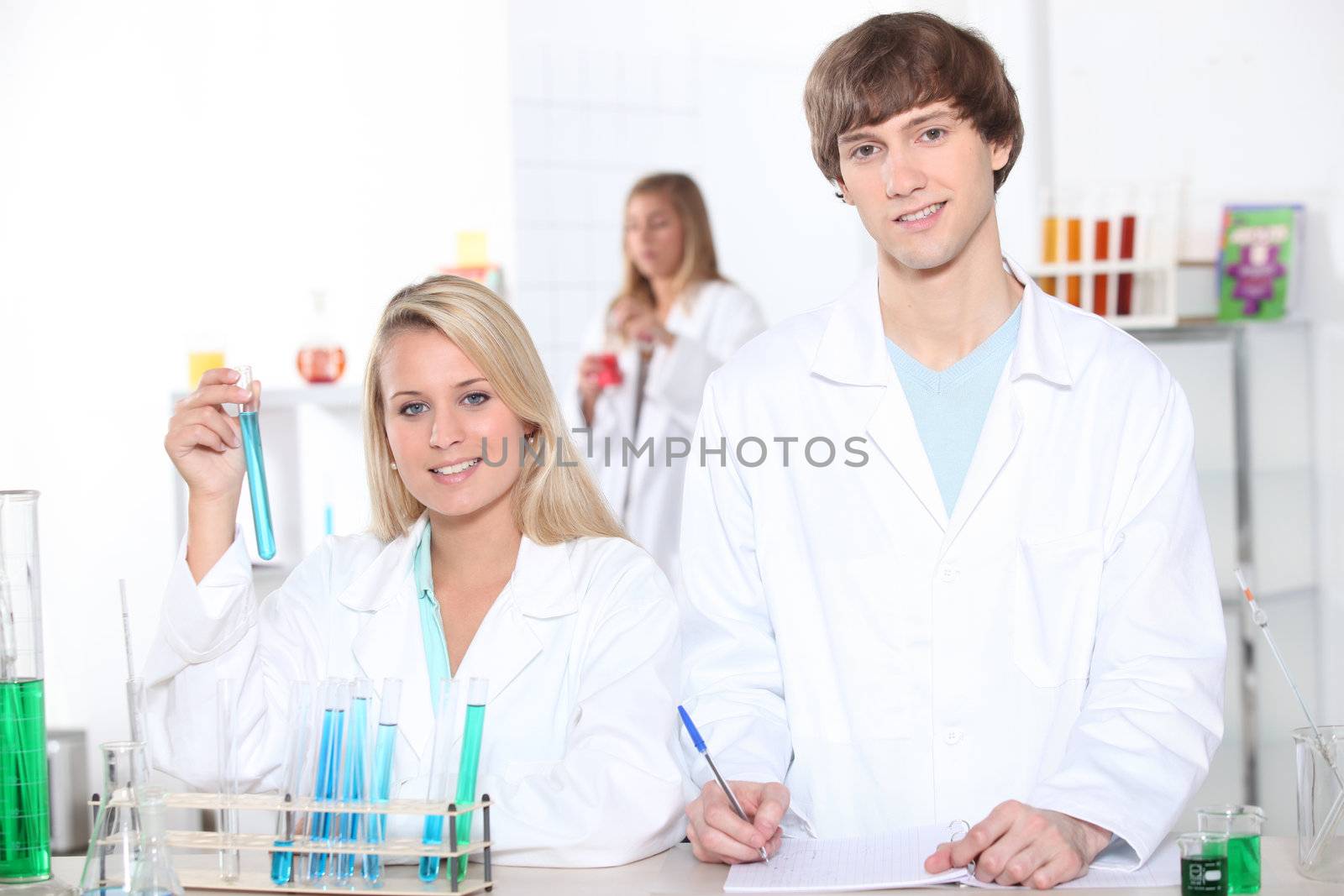 young woman and young man in a laboratory by phovoir