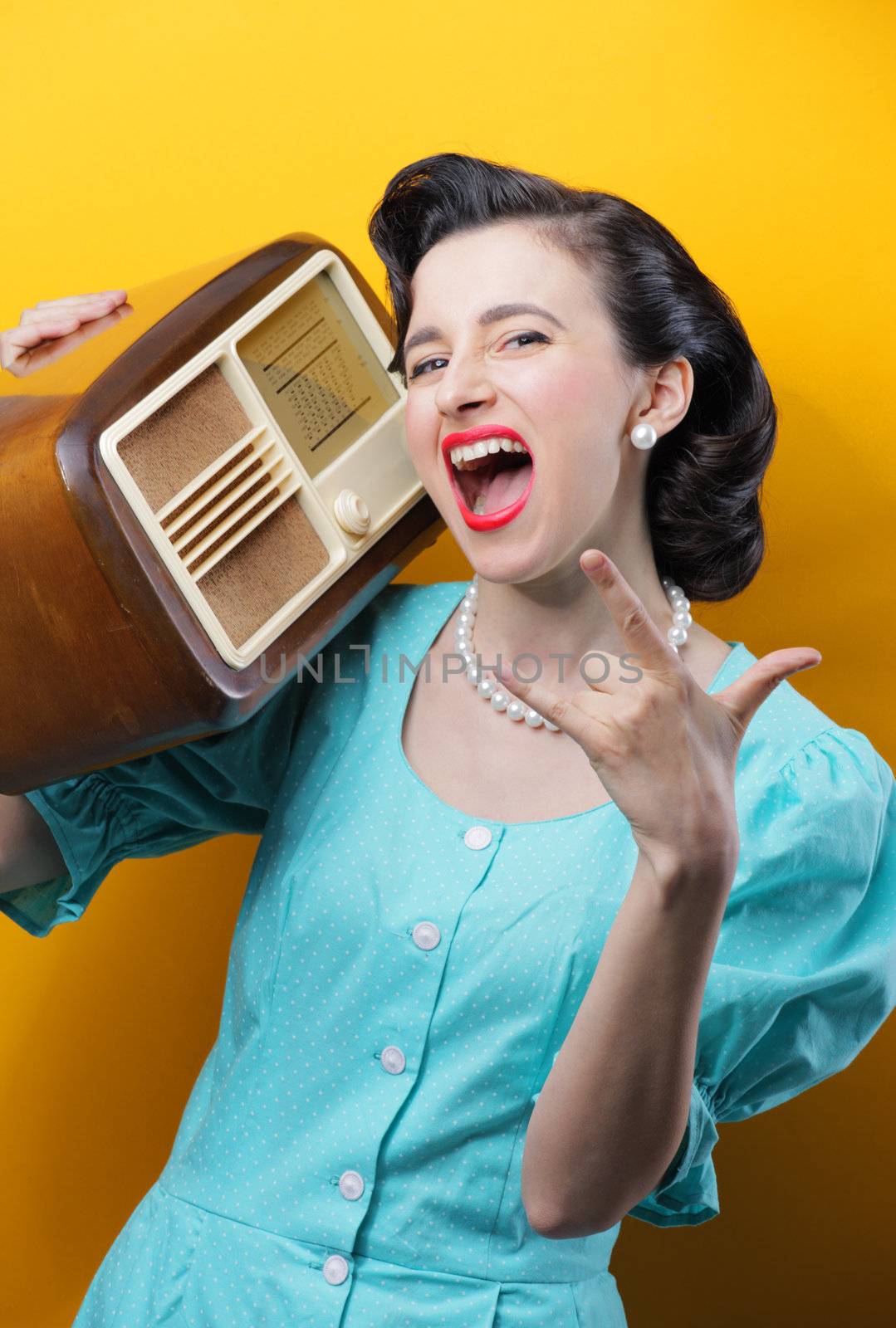 Retro styled woman enjoying the music