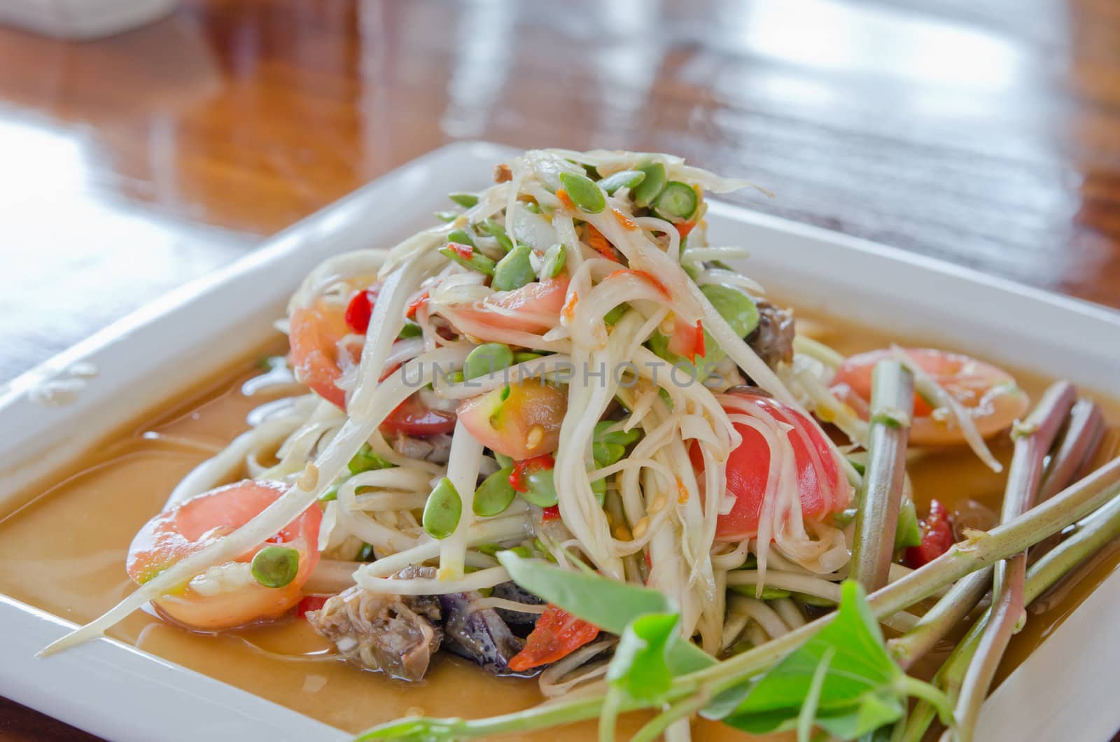 favorite food of thailand,  spicy papaya salad  with mixed vegetable on  dish