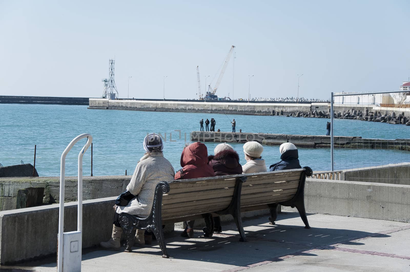 People are enjoying by the sea in sunny day