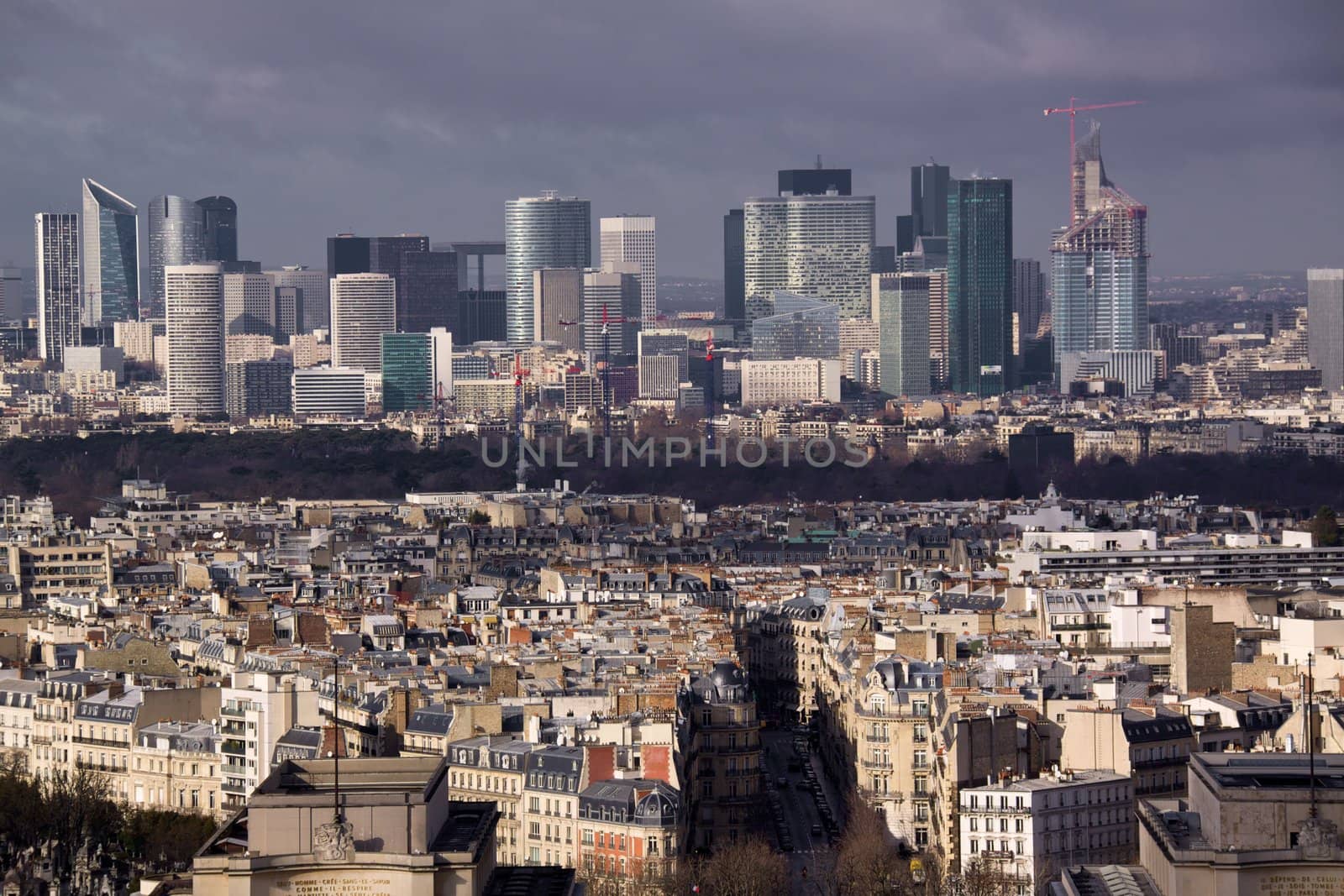 Rooftops of Paris with business quarter La Defense in the background