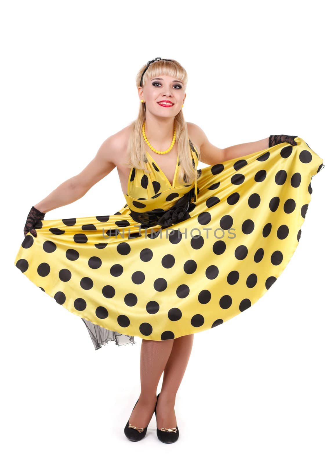 Young dancer woman in yellow dress.