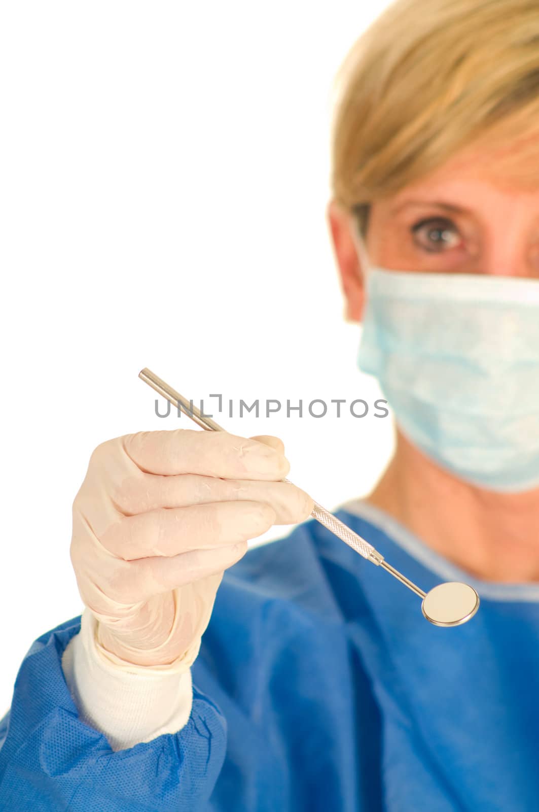 dentist holding dental mirror by ambro