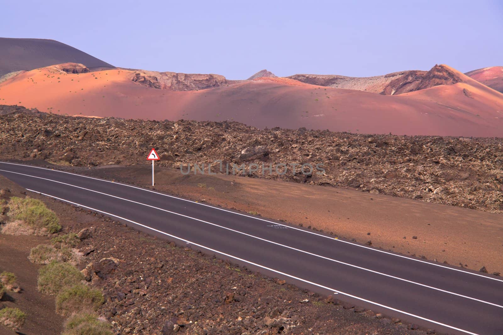 Road across volcanic park Timanfaya on island of Lanzarote, Canary Islands