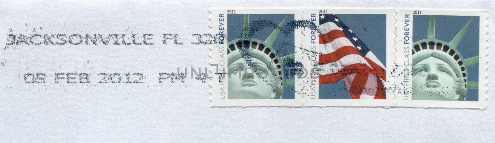 USA - CIRCA 2011: Stamps printed by USA post showing American patriotic symbols Statue of Liberty and Flag circa 2011 in USA
