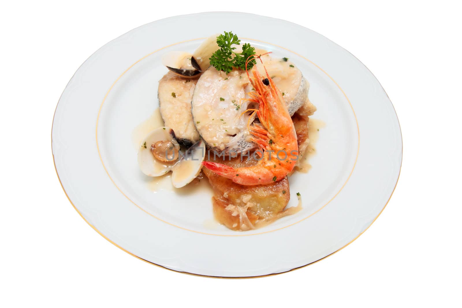 dish of hake cooked potatoes with prawns and clams onion parsley cut off and isolated