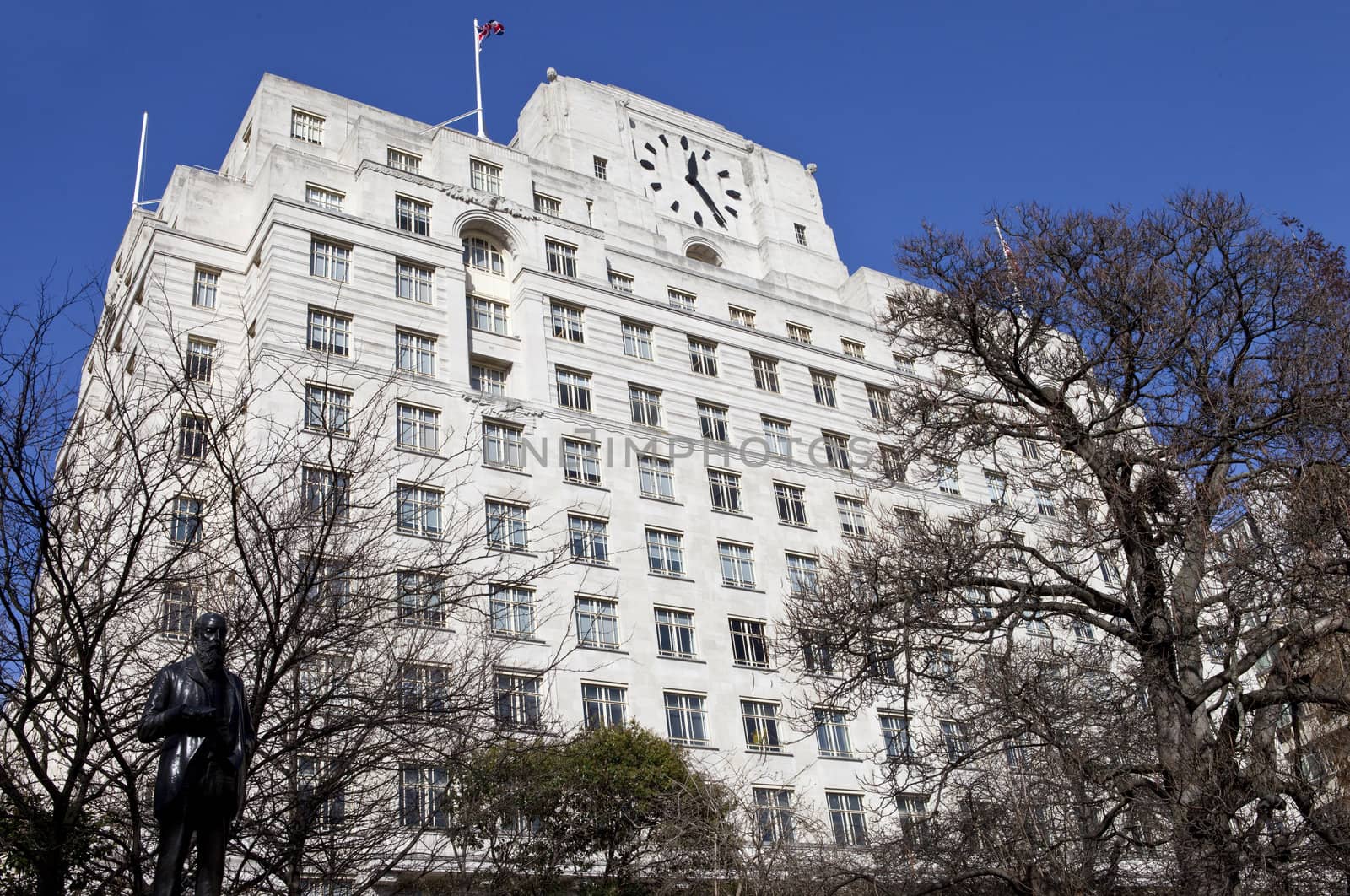 Looking up at the art deco facade of Shell Mex House.