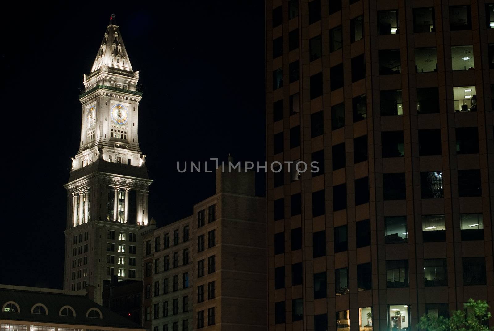 The Customs House Tower at night in Boston, MA