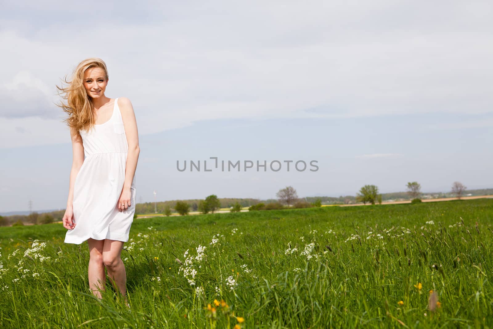 beautiful blonde woman outdoor in summer happy by juniart