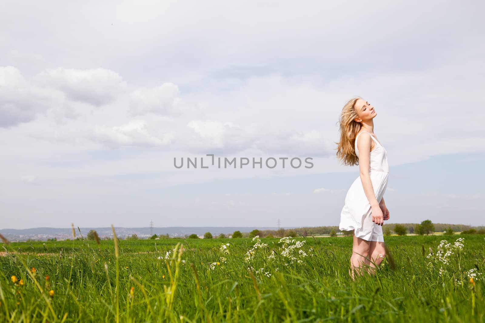 beautiful blonde woman outdoor in summer happy by juniart