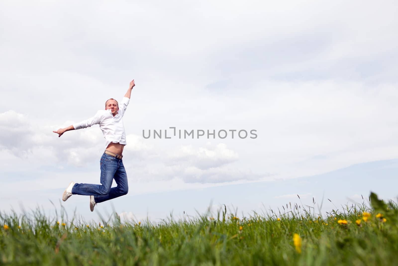 young man outdoor in summer in nature happy