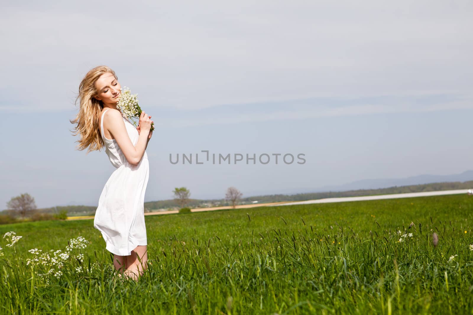 beautiful blonde woman outdoor in summer happy by juniart
