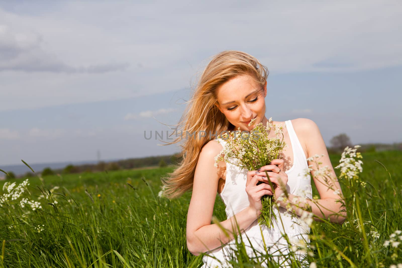 beautiful blonde woman outdoor in summer happy by juniart