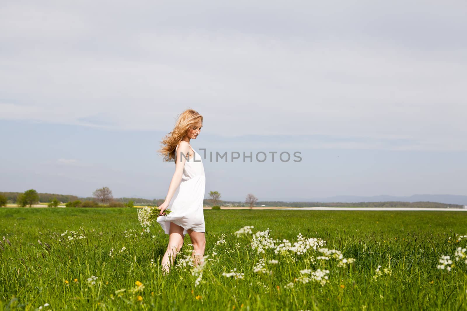 beautiful blonde woman outdoor in summer happy