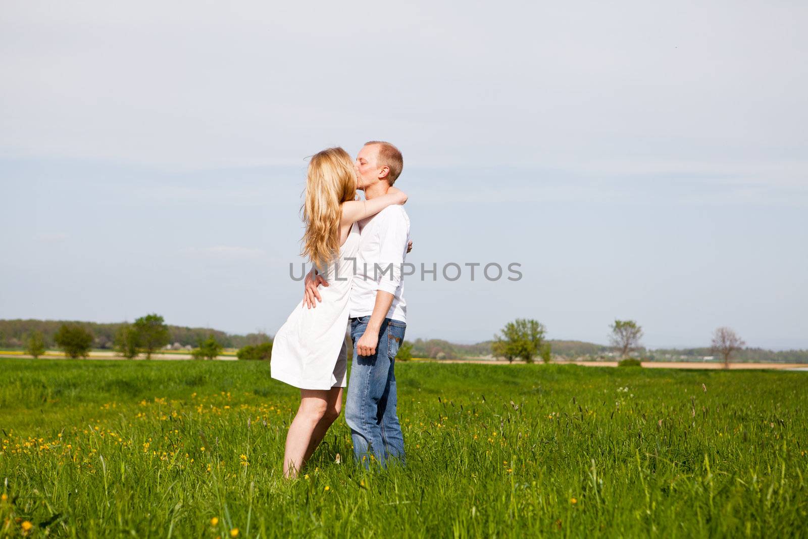 young happy couple have fun in summer outdoor in nature