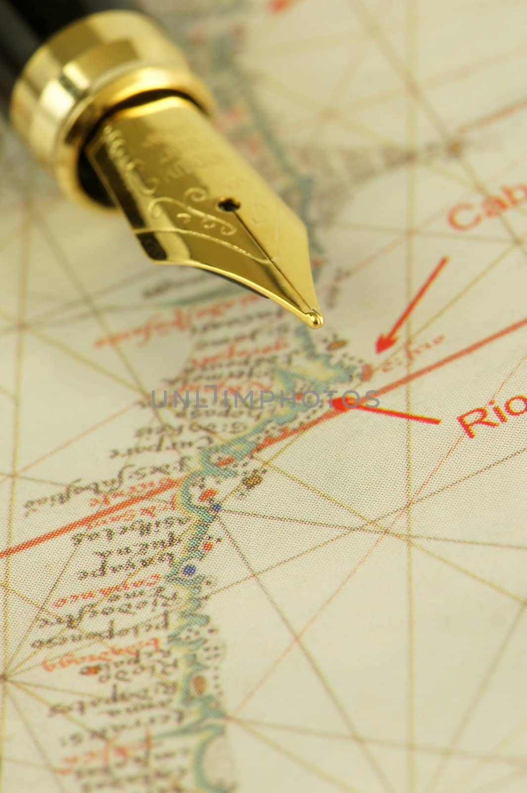 A nib pen on a fragment of an ancient nautical chart representing the coast of Brazil