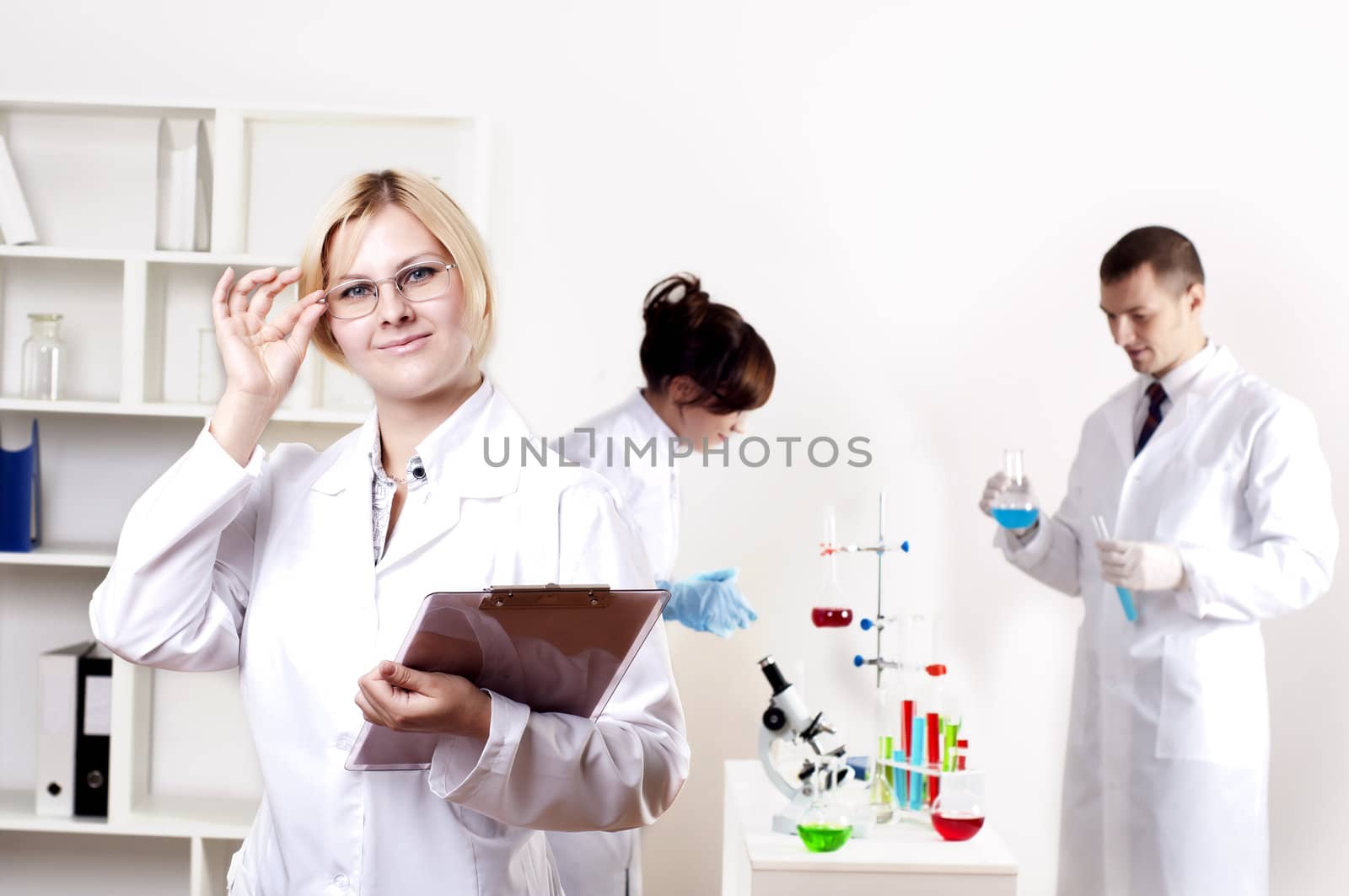 portrait of doctor, holds a tablet in the office