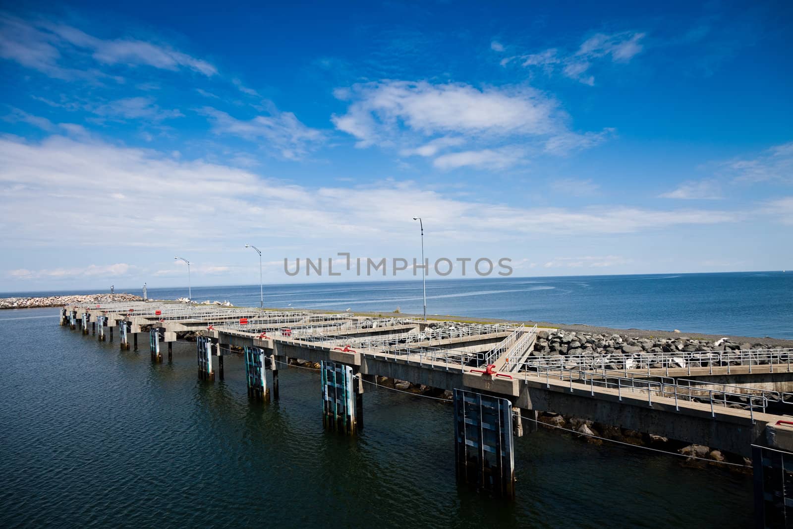 View of pier and the port on a sunny day of summer