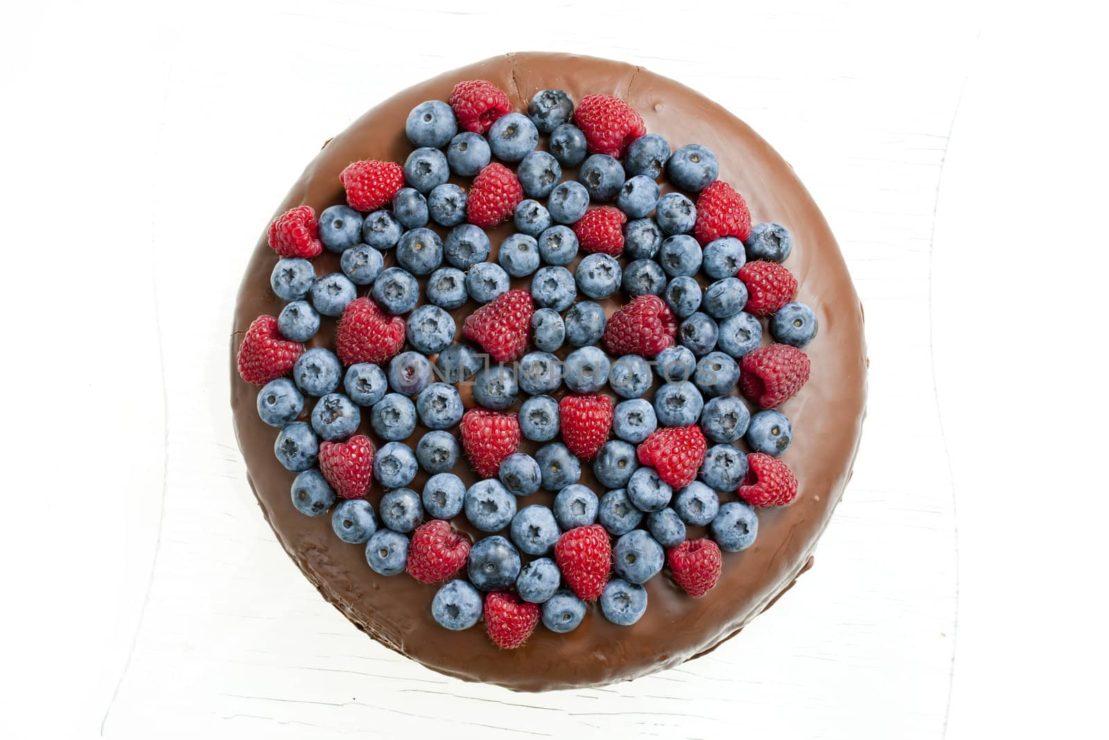 chocolate cake with raspberries and blueberries