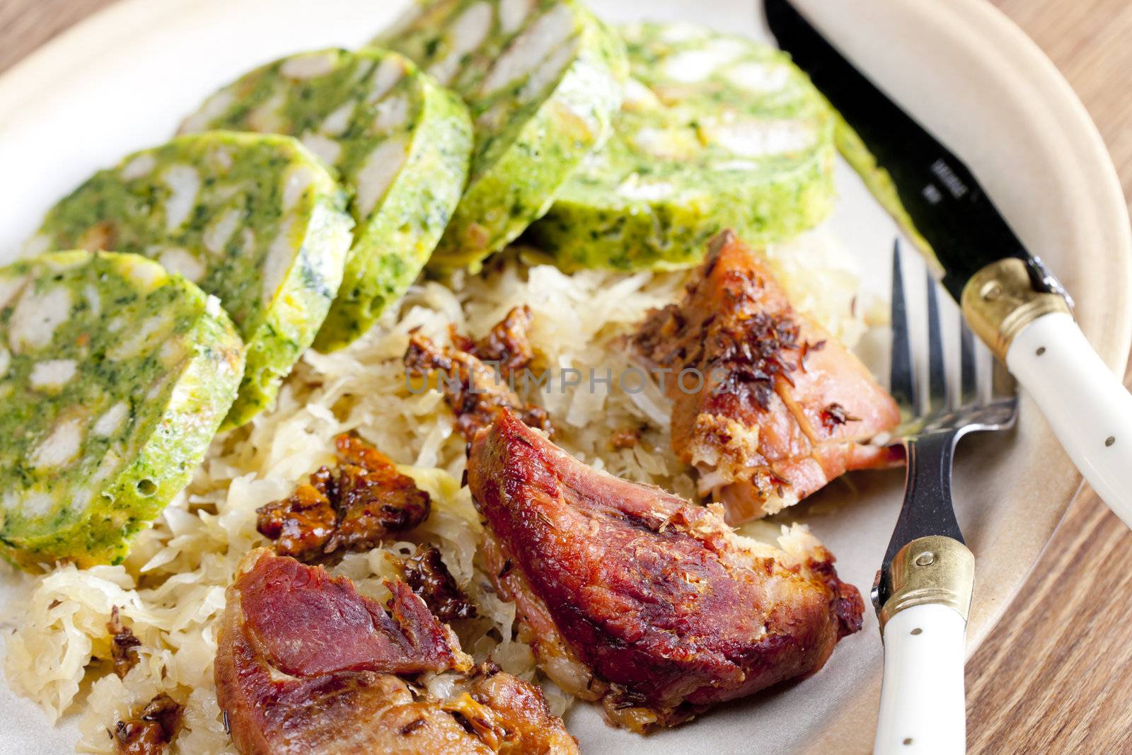 pork meat with herbal dumplings and cabbage