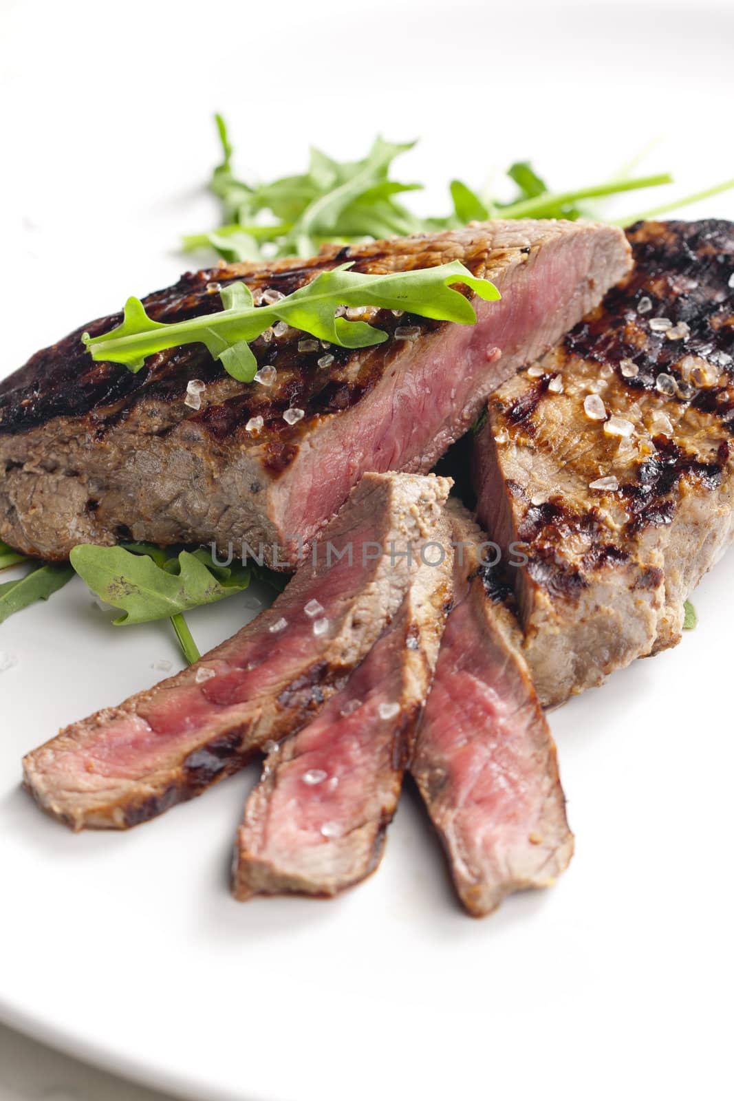 grilled beefsteak pickled in Dijon mustard with ruccola