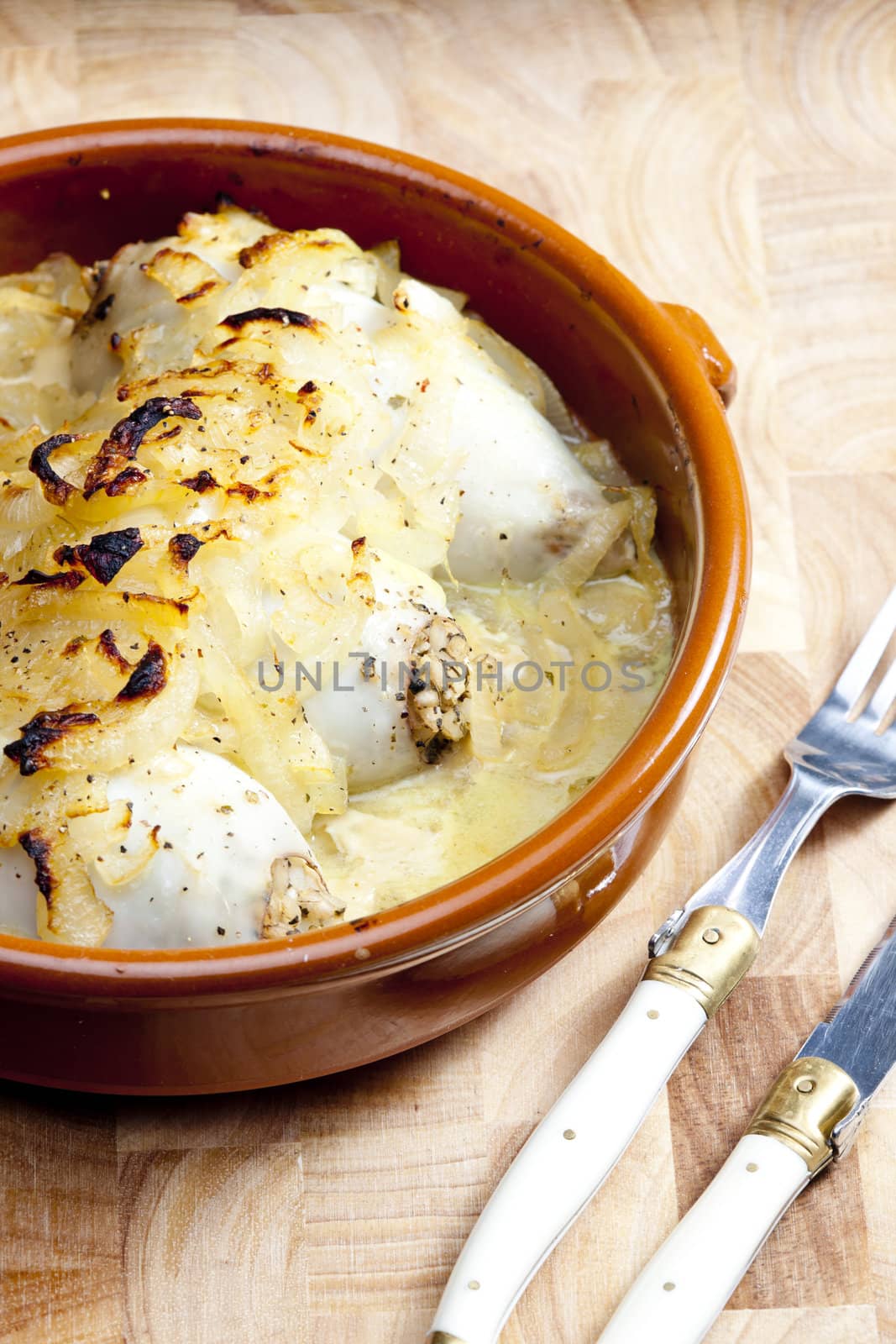 sepias filled with pearl barley baked with onion