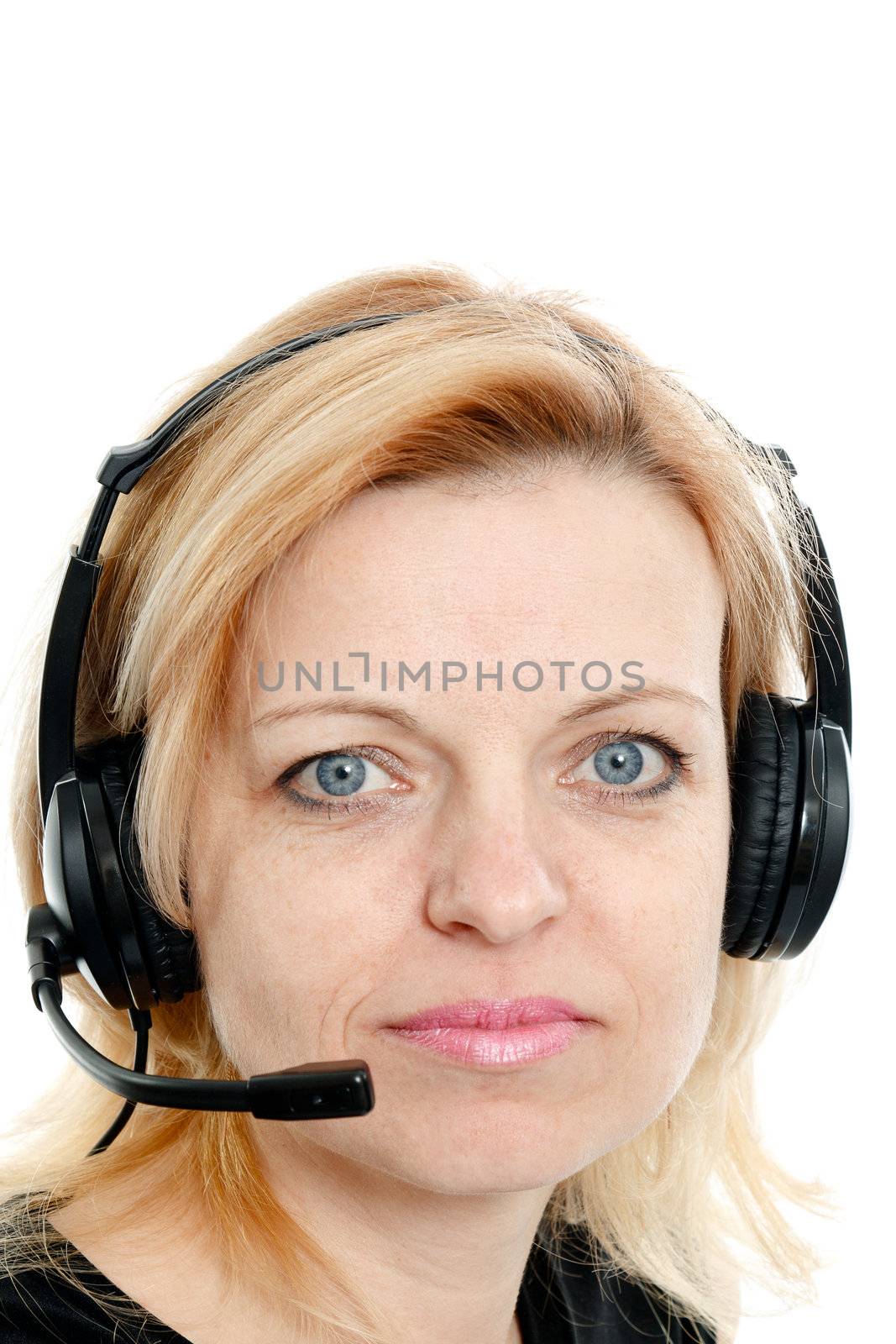 Mid-year woman with headphones and a microphone on a white background