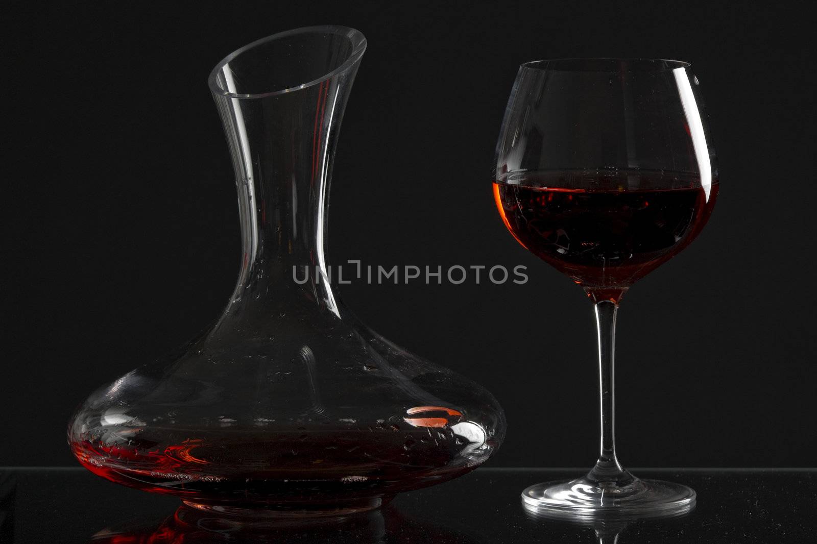 wine glass and carafe with red wine by phbcz
