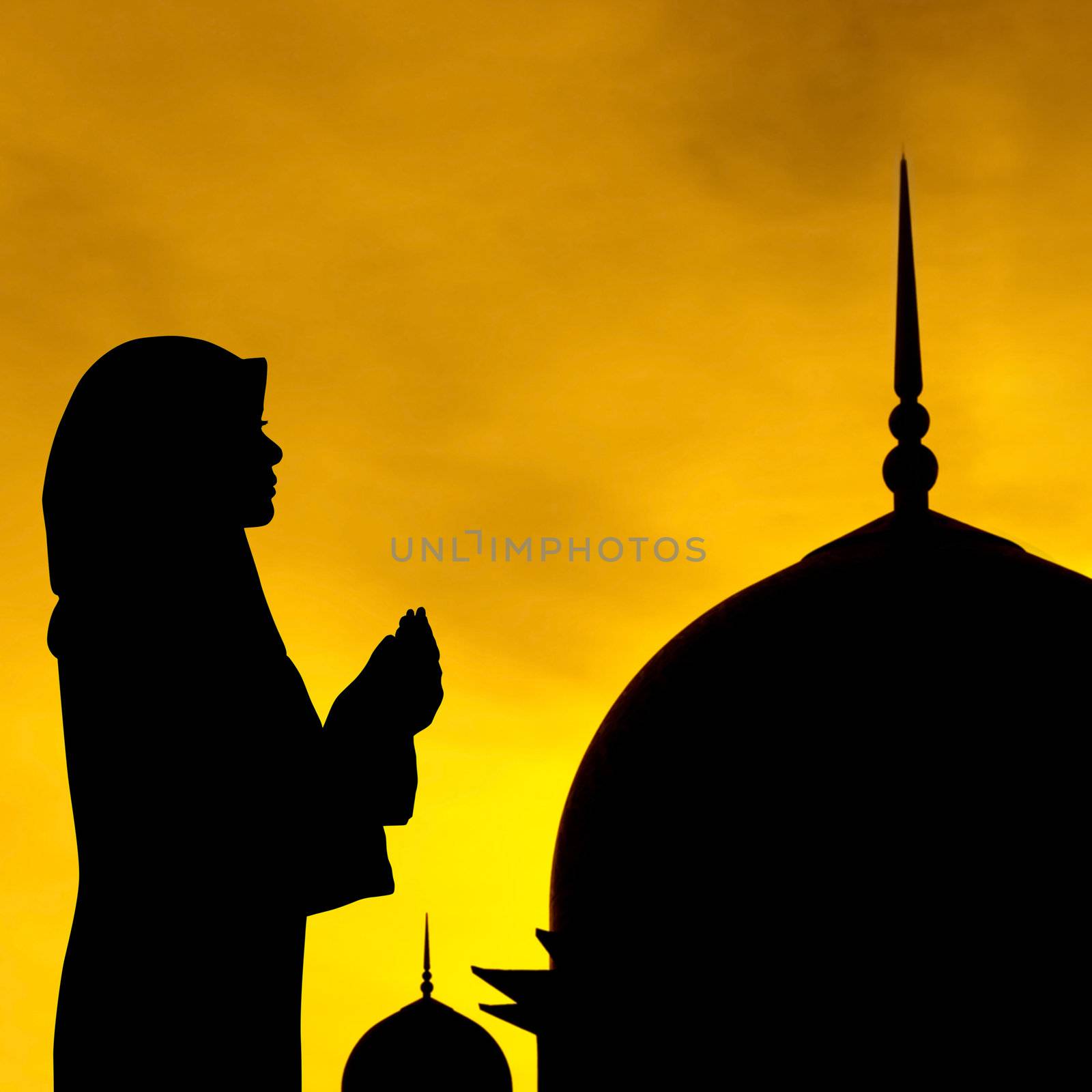 Silhouette of prayer and mosque in sunset.