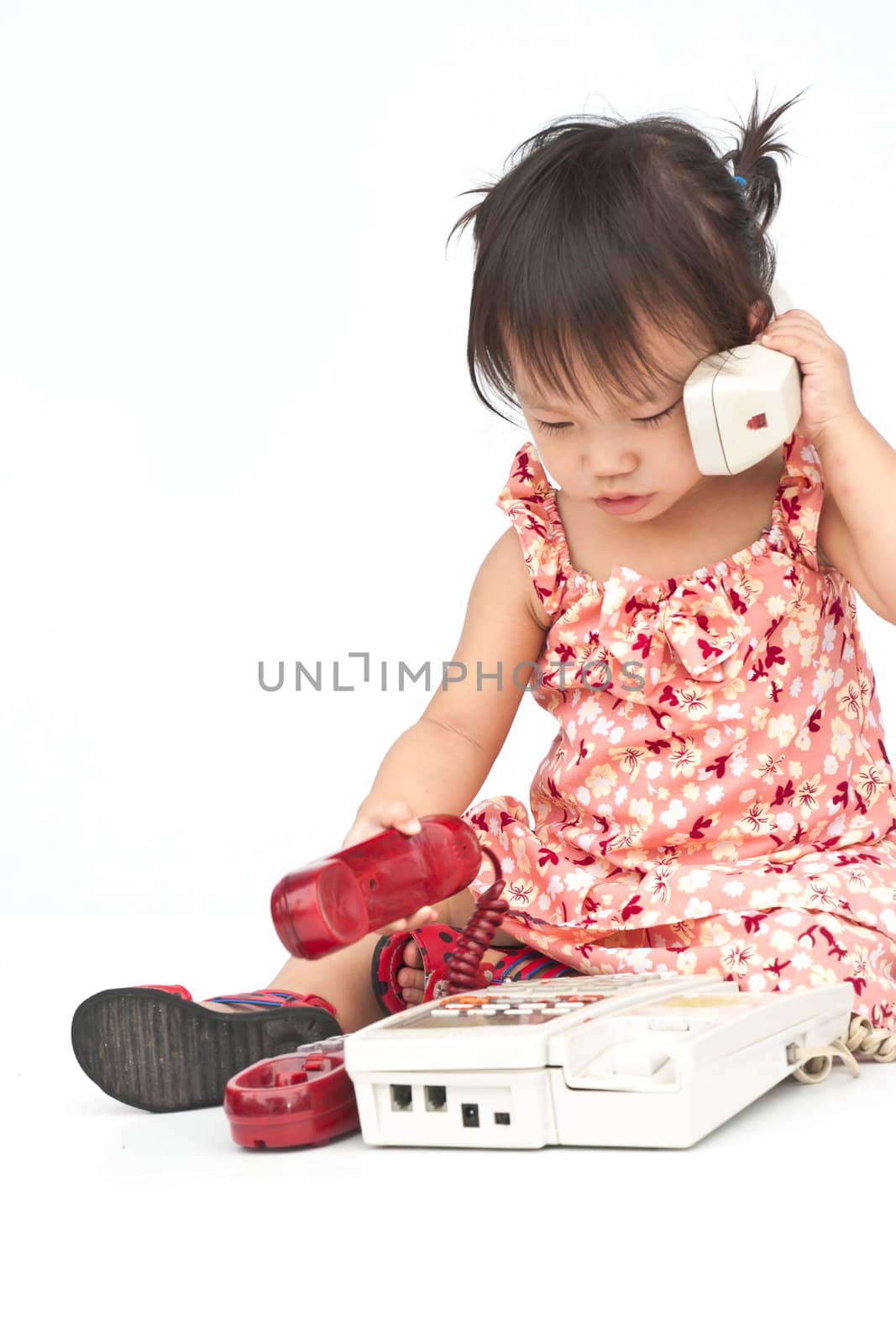 Baby dialing old beige phone calling mom  by Yuri2012