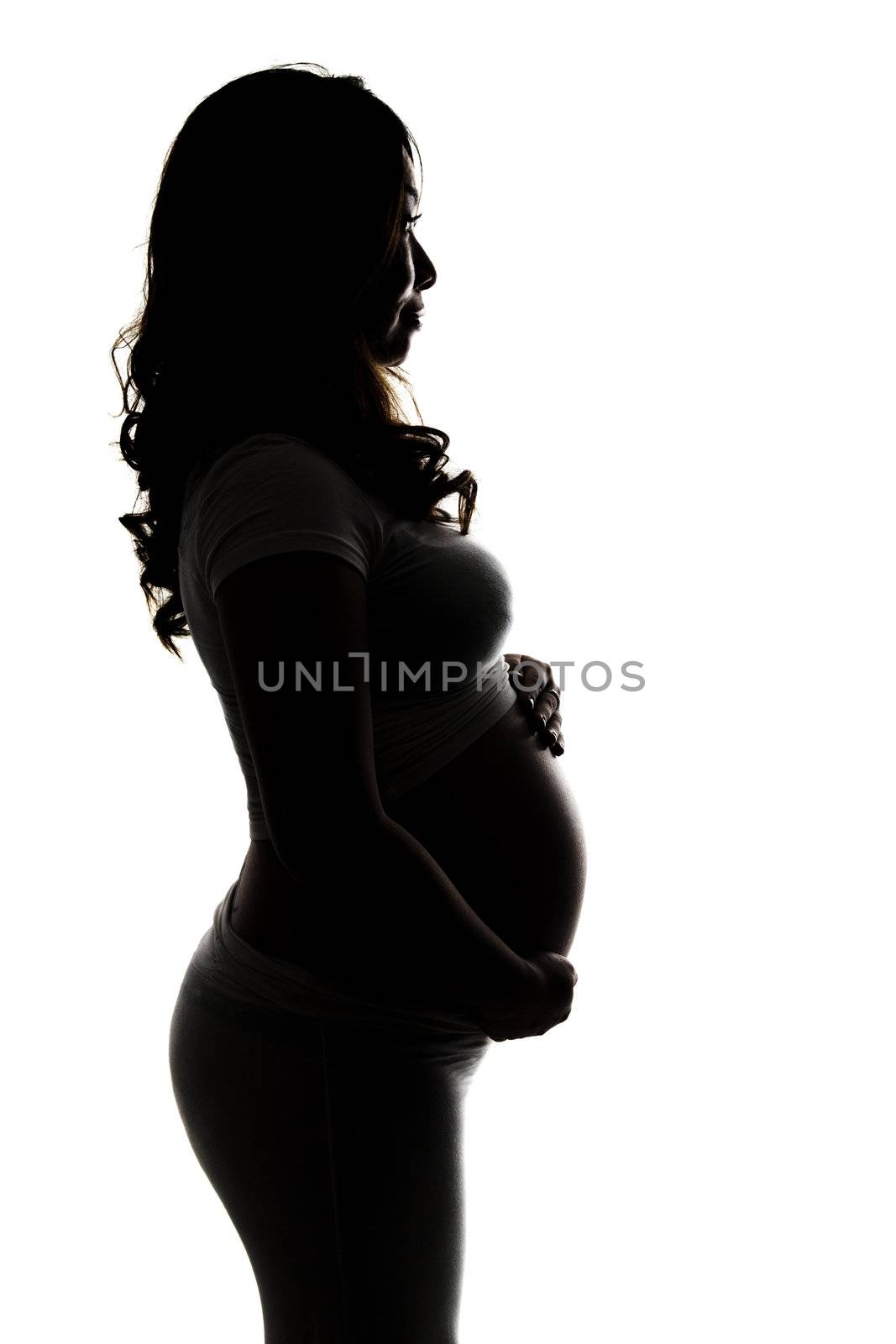 Silhouette of a pregnant woman on white background