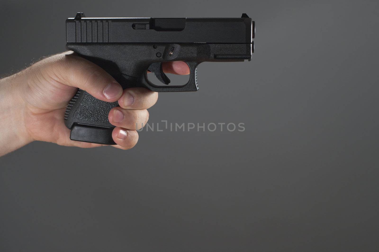 Holding Gun Gray Background by mary981
