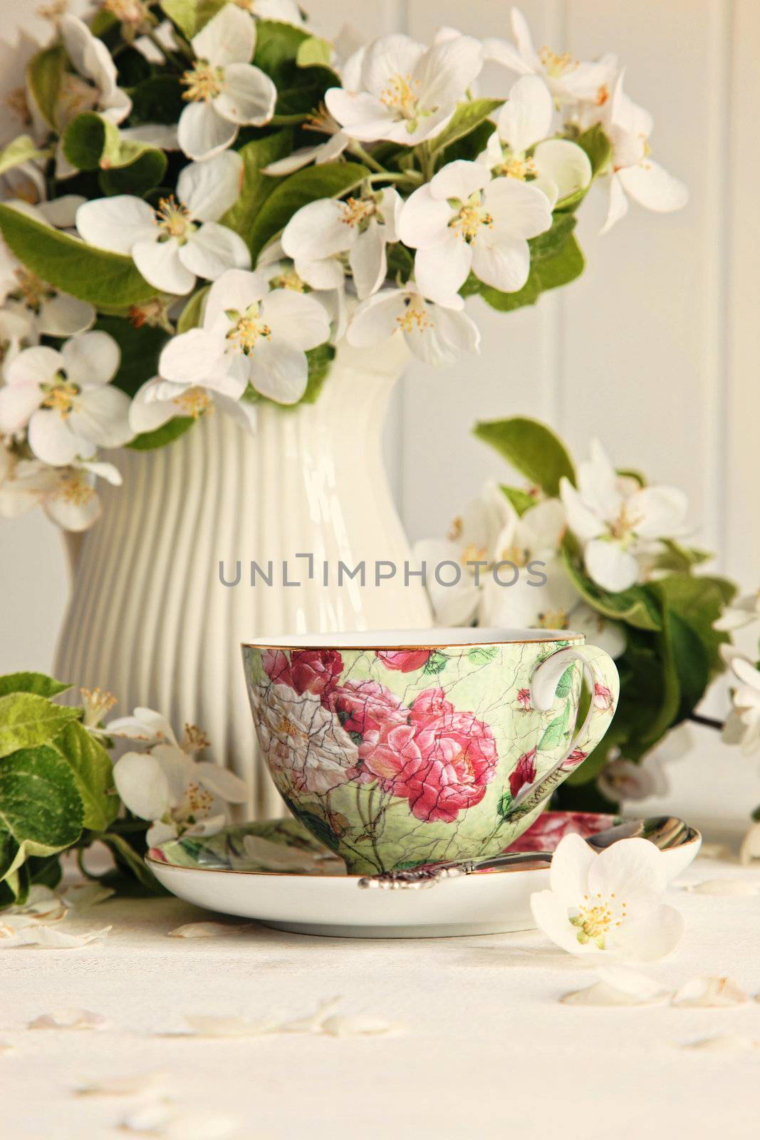 Tea cup with fresh flower blossoms by Sandralise