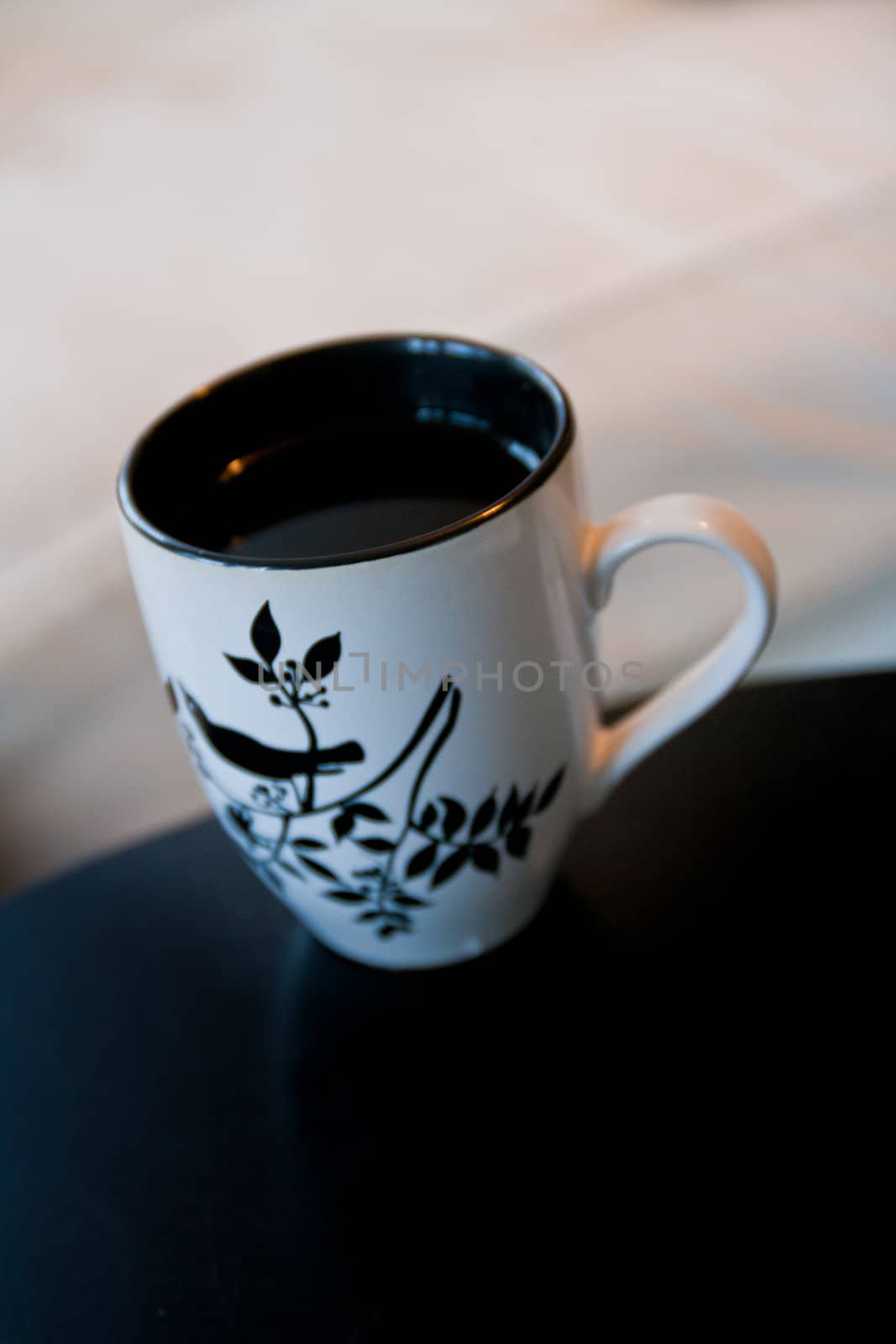 White cup on a black table