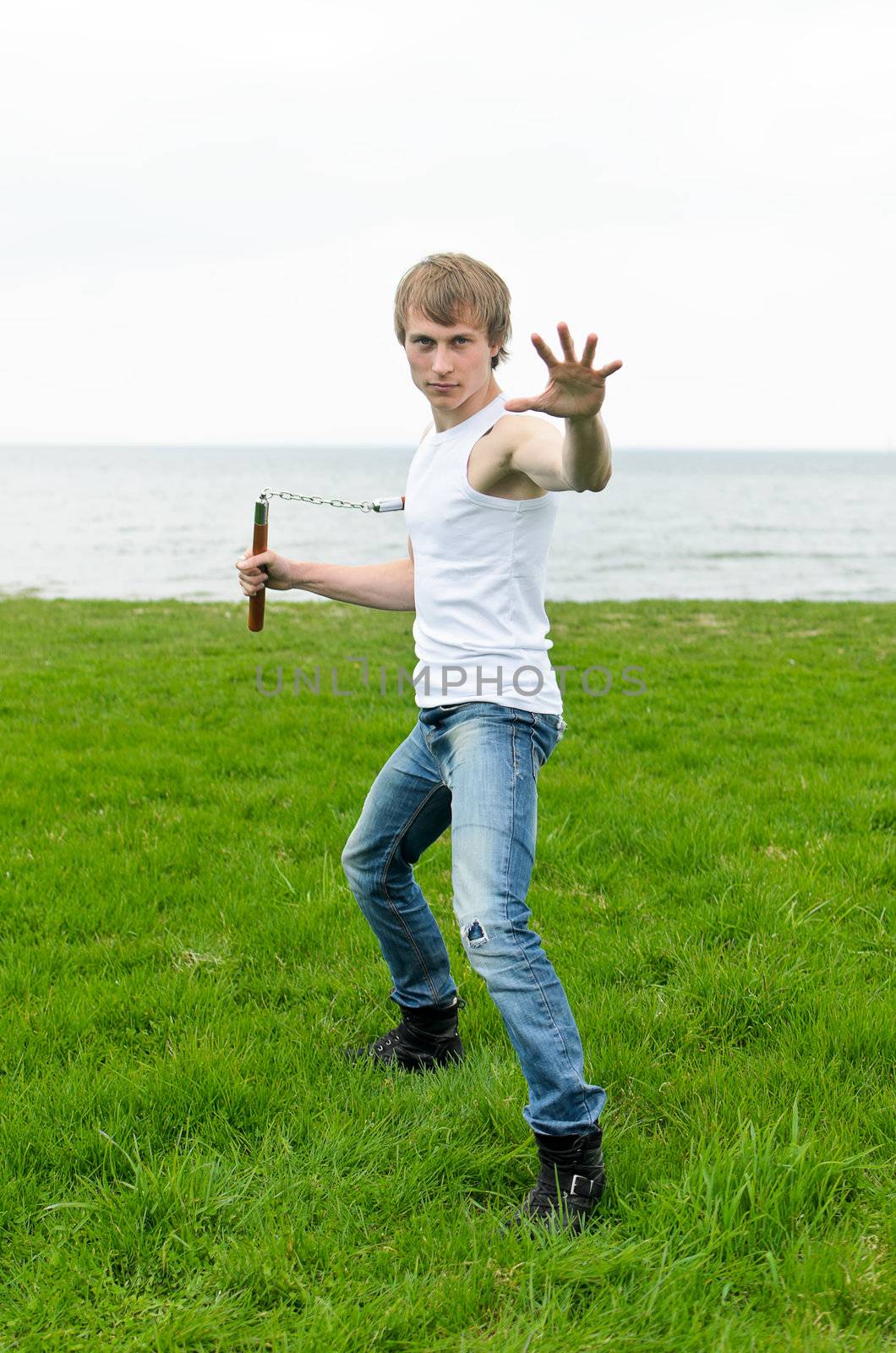 Martial arts: Man with nunchaku 