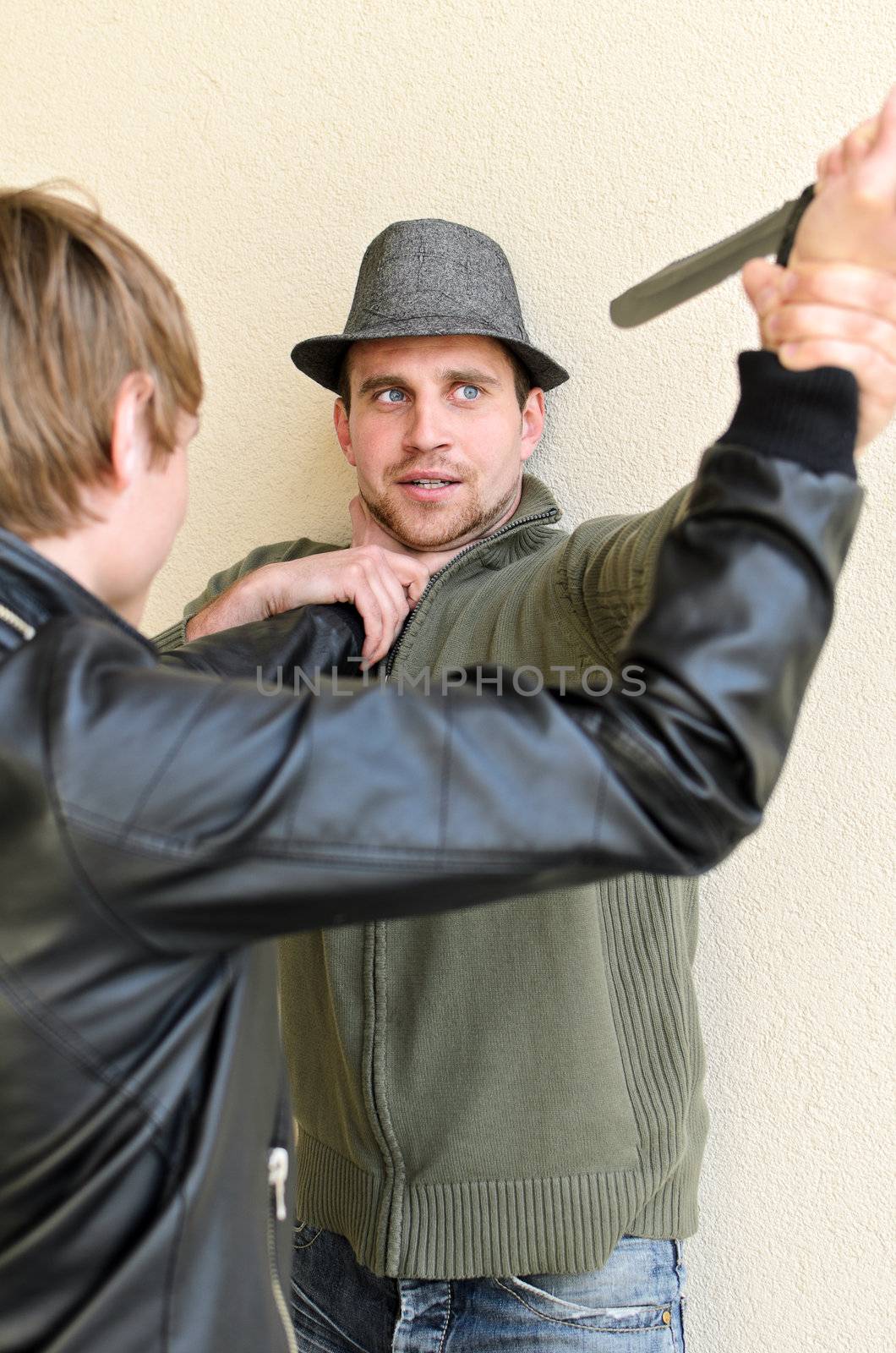 Burglar is trying to kill man by knife.