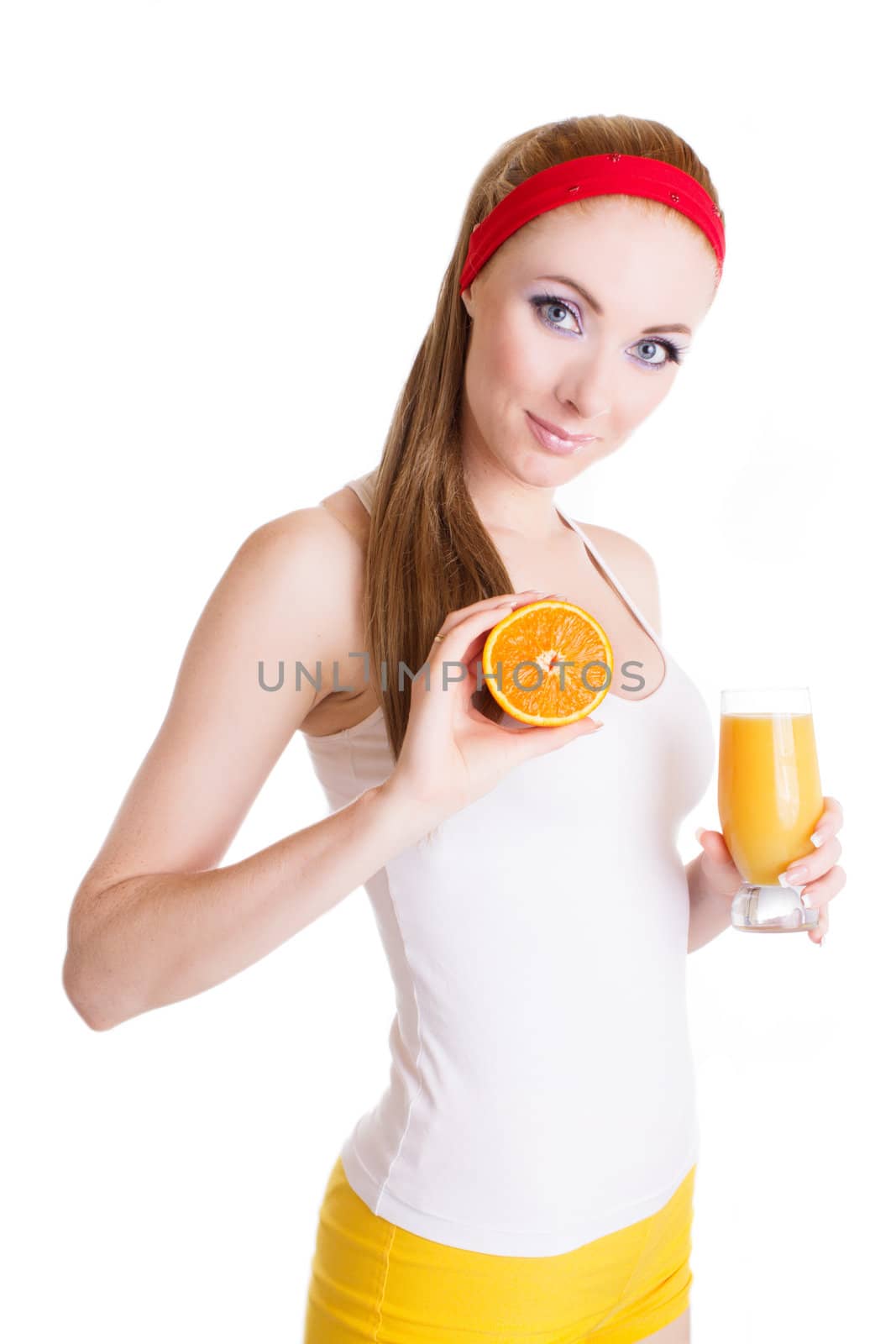 Sporty woman with orange juice and fruit over white