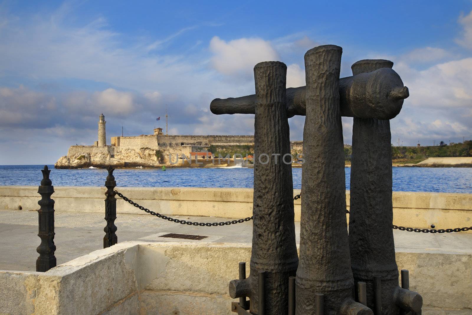 A view old cannon pointing towards El Morro fortress in Havana bay entrance 