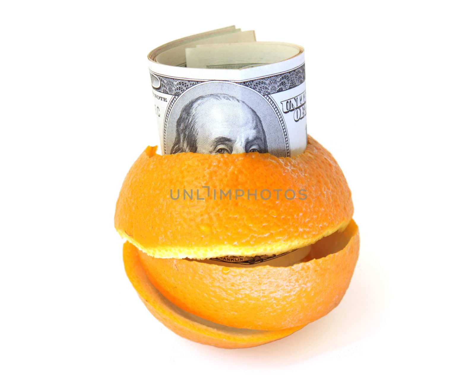 100 dollars banknotes inside of orange peel