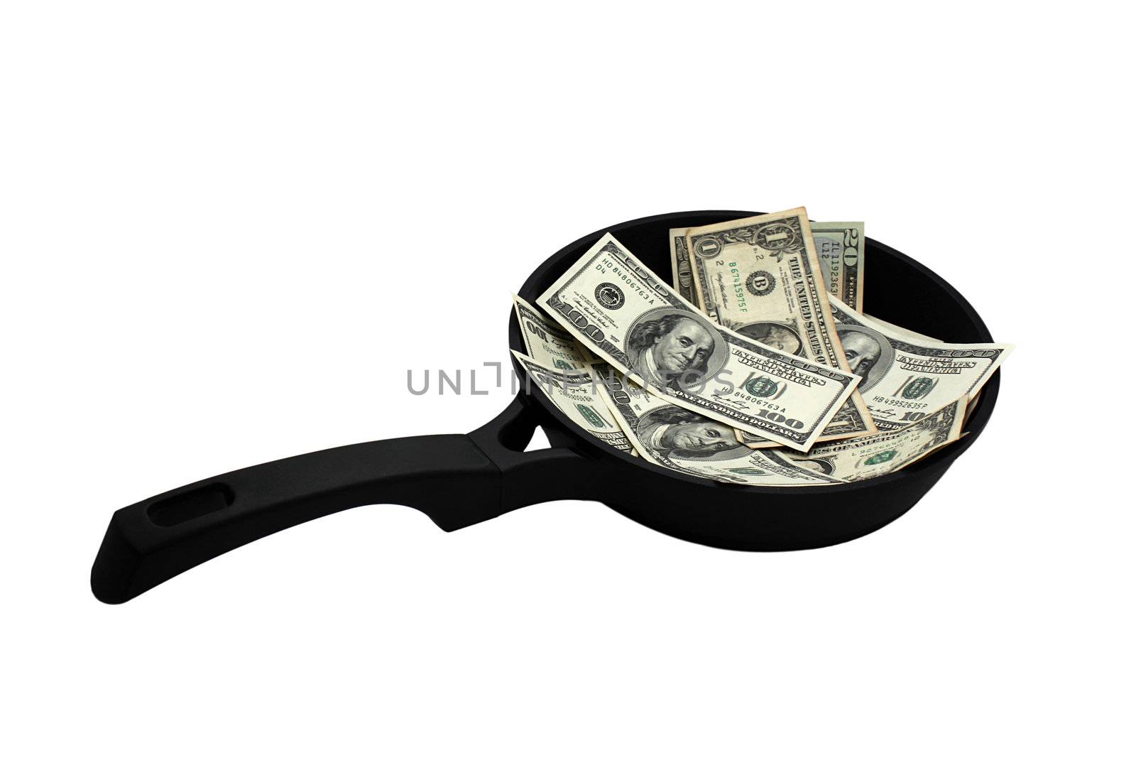 frying pan with dollars over white
