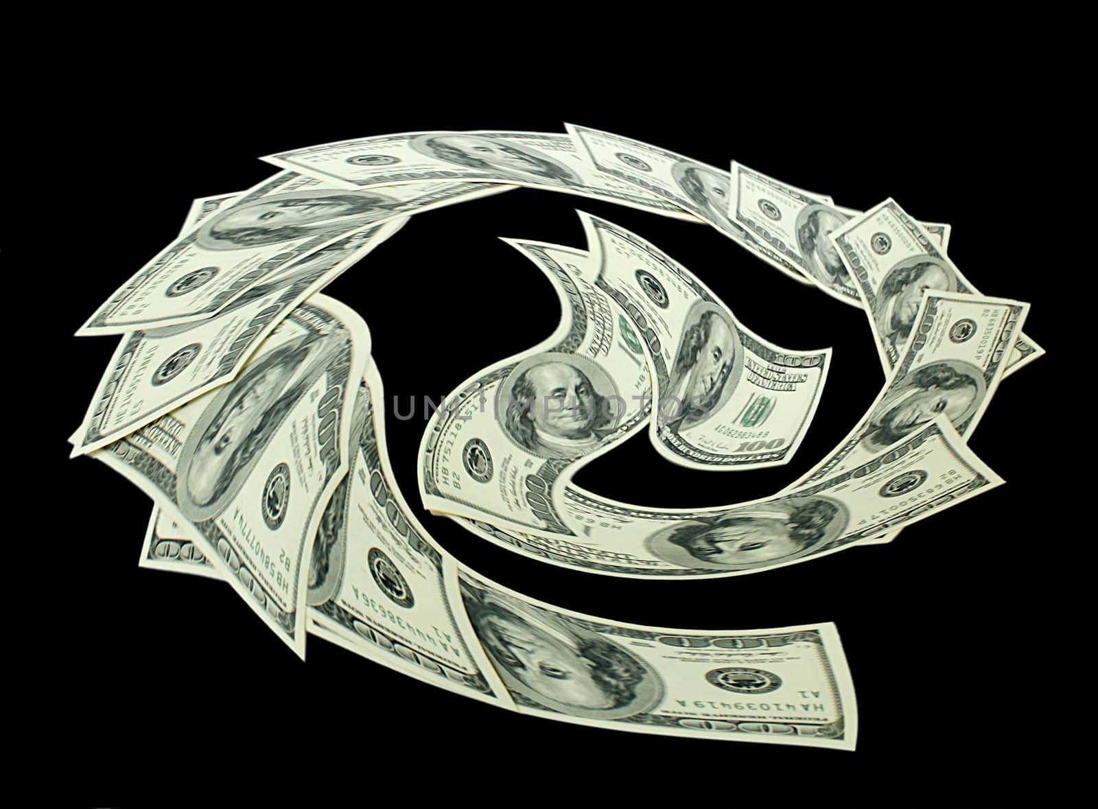twirl of money (100 dollars) over black background