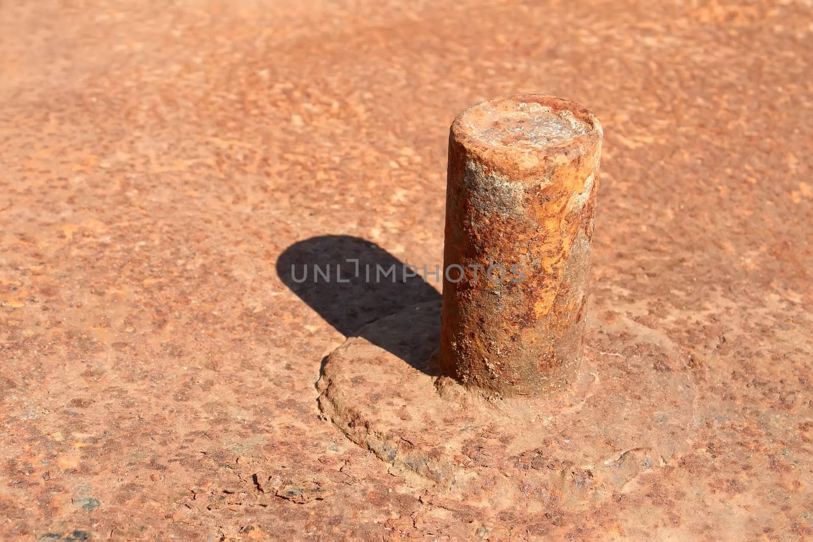 Metal pipe welded to the rusty metal platform