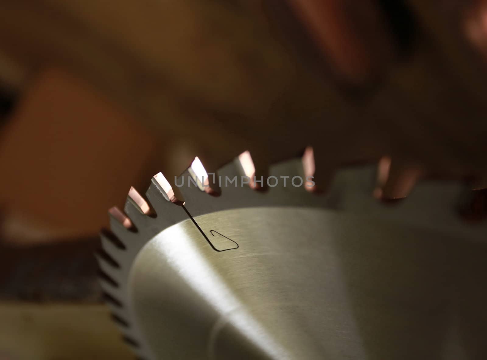 sharp teeth of the saw blade in close-up, the fragment