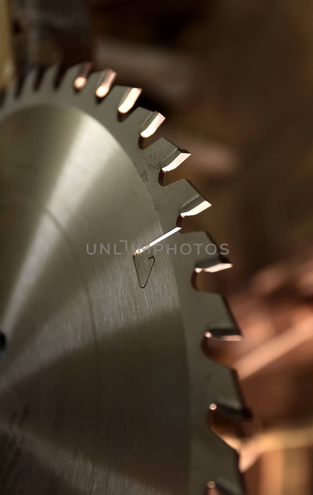 sharp teeth of the saw blade in close-up, the fragment