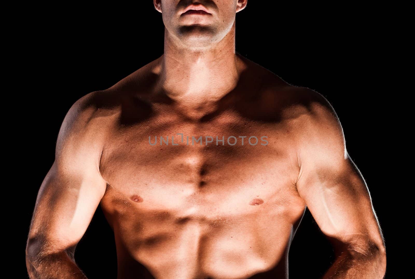 Muscular man isolated on black background