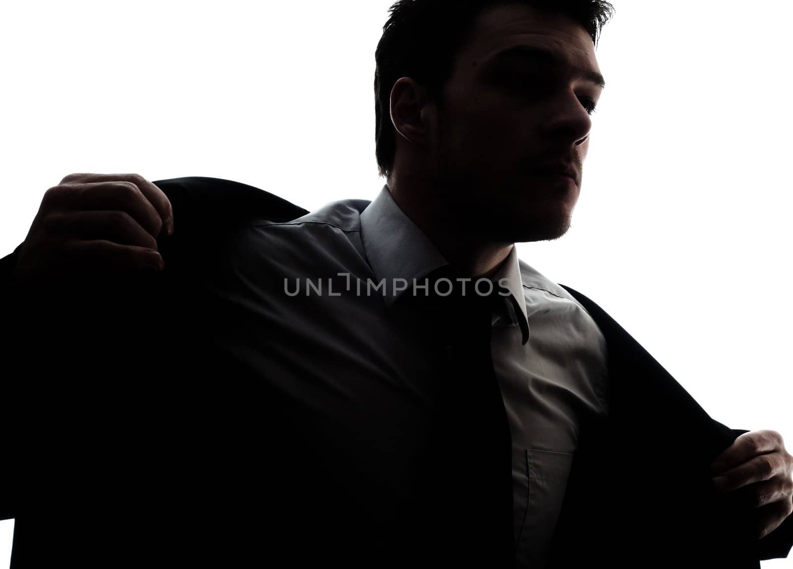 Businessman portrait silhouette getting dress - putting his jacket