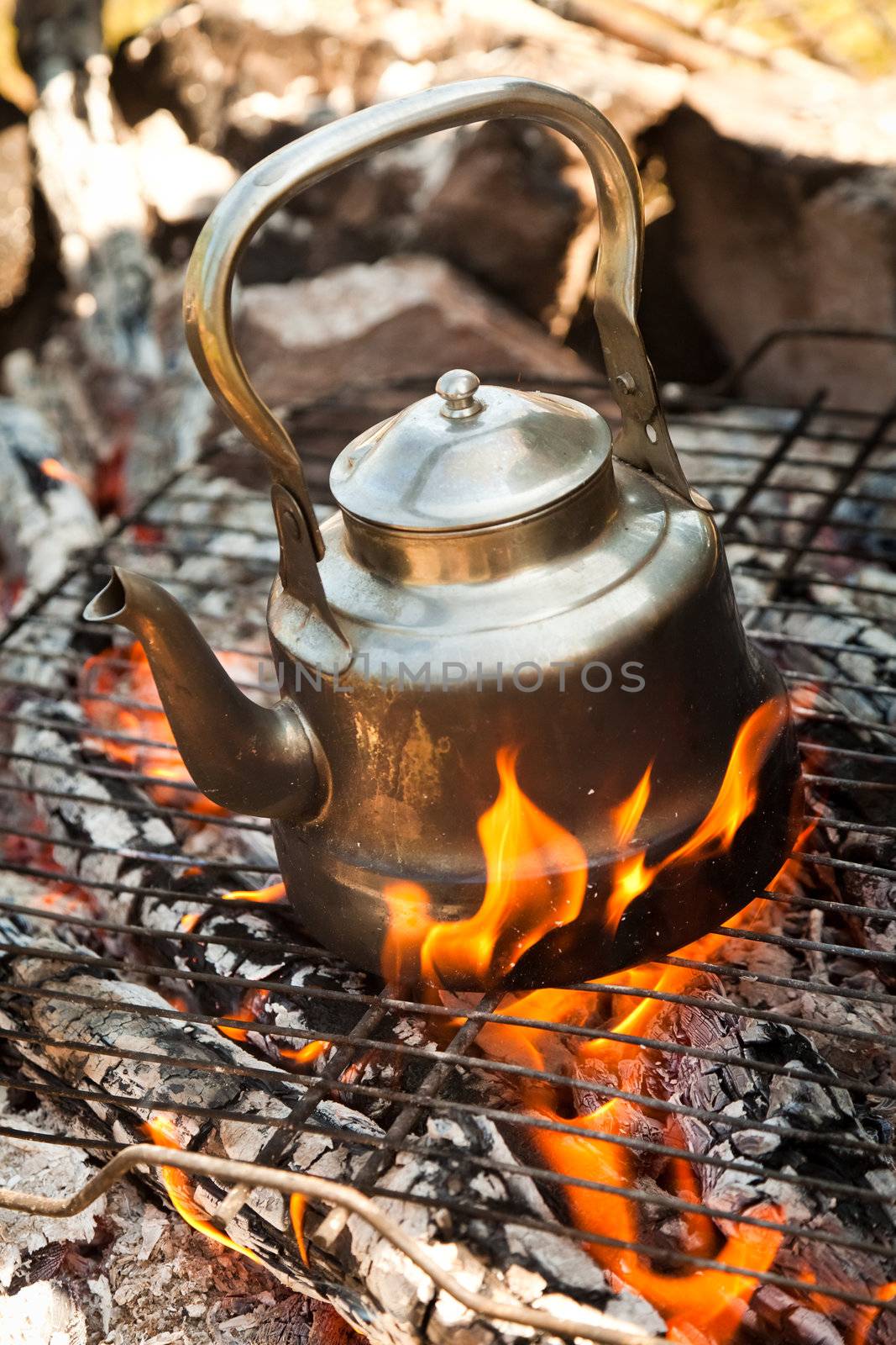 Kettle with water heated on the fire