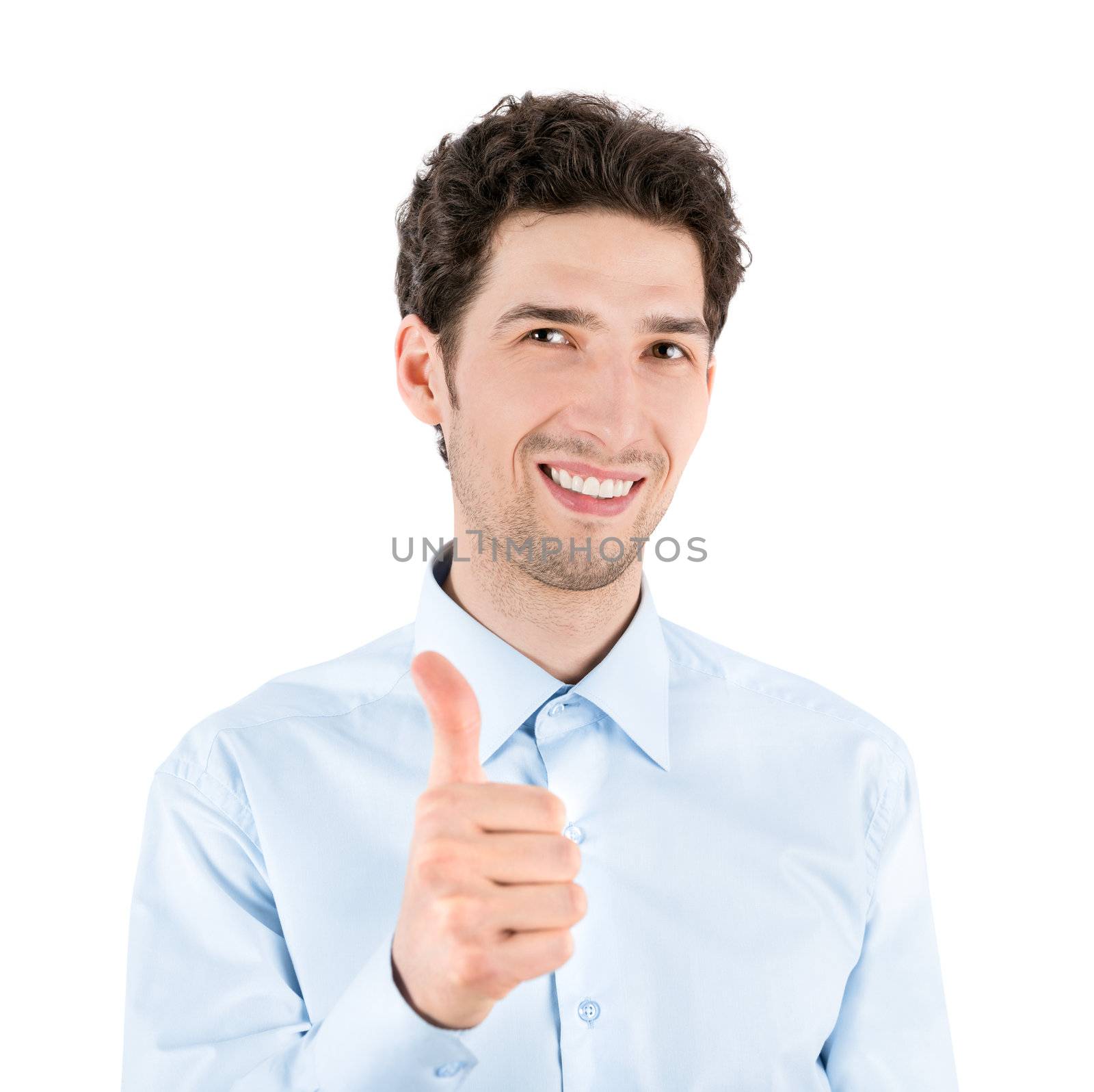 Close-up portrait of a successful handsome businessman who smiles and shows a thumb up gesture to camera. Isolated on white background.