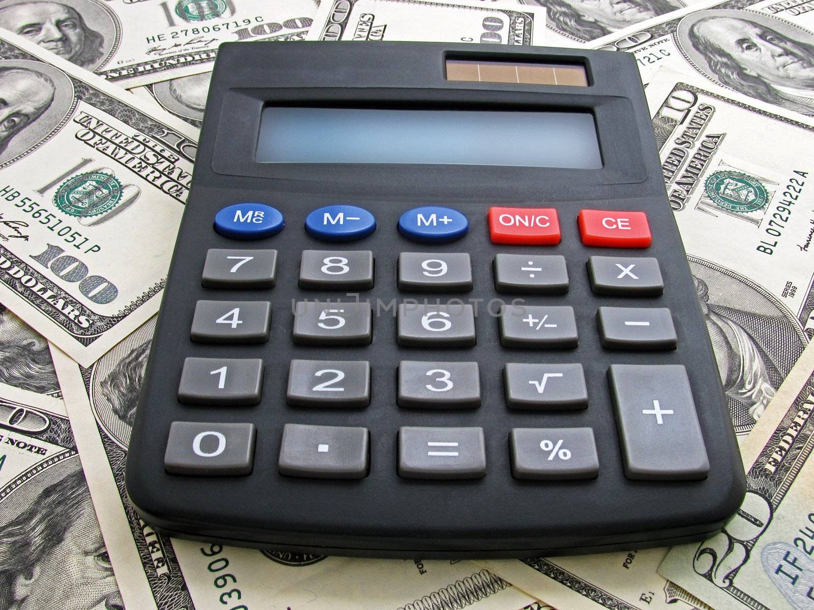 calculator on heap of dollars