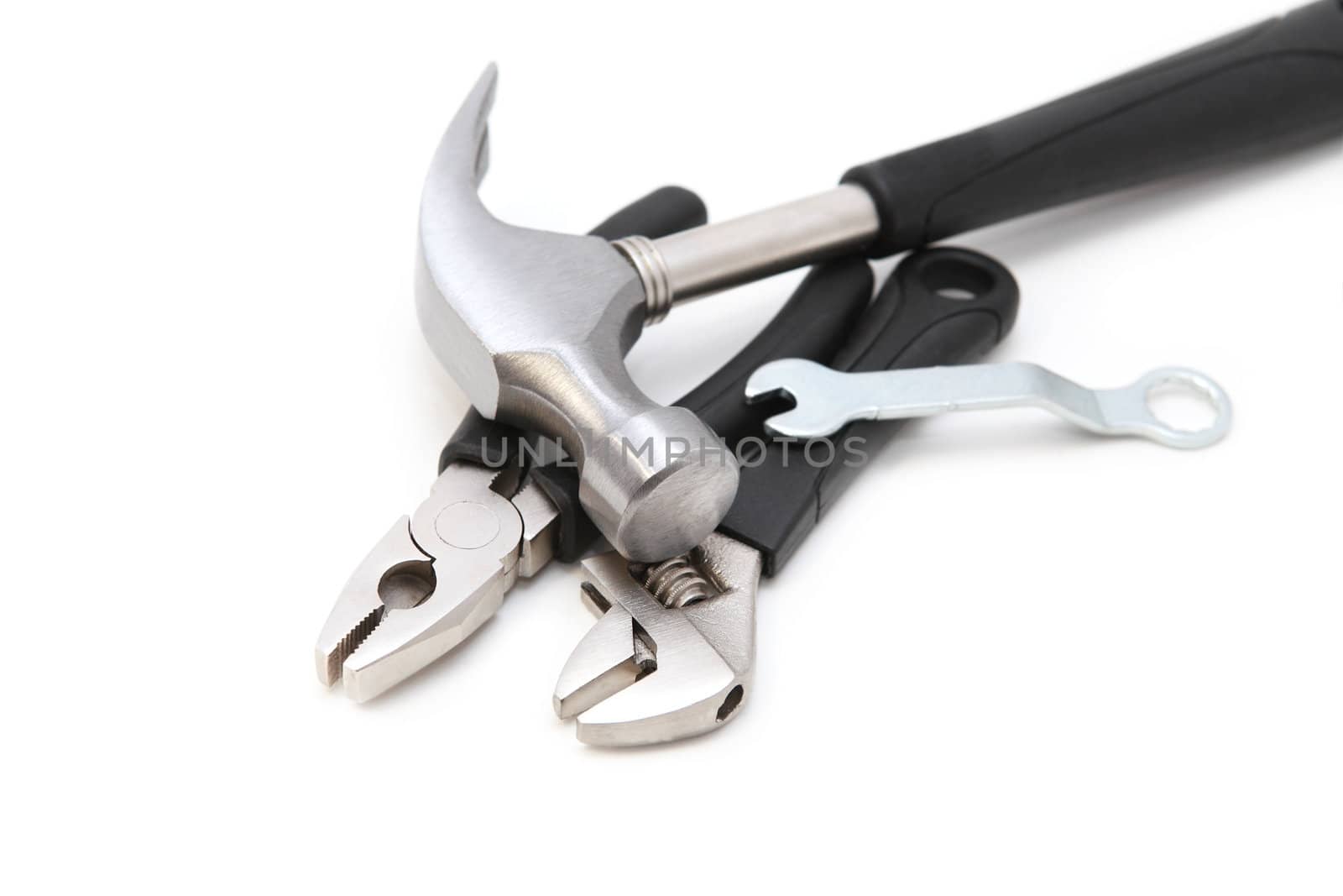 working tools - pliers, key, hammer, wrench on white